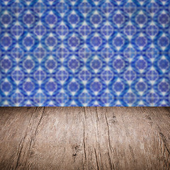 Image showing Wood table top and blur vintage ceramic tile pattern wall