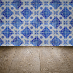 Image showing Wood table top and blur vintage ceramic tile pattern wall