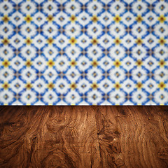 Image showing Wood table top and blur vintage ceramic tile pattern wall