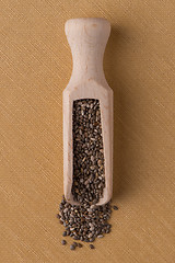 Image showing Wooden scoop with chia seeds
