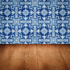 Image showing Wood table top and blur vintage ceramic tile pattern wall