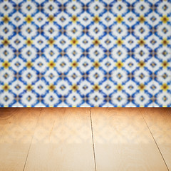 Image showing Wood table top and blur vintage ceramic tile pattern wall