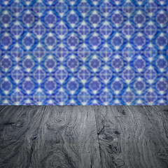 Image showing Wood table top and blur vintage ceramic tile pattern wall