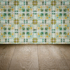 Image showing Wood table top and blur vintage ceramic tile pattern wall