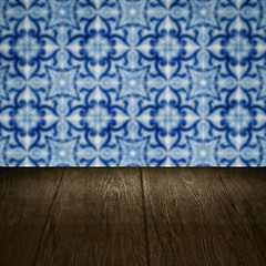 Image showing Wood table top and blur vintage ceramic tile pattern wall