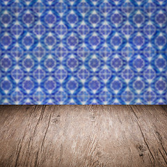 Image showing Wood table top and blur vintage ceramic tile pattern wall