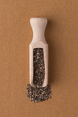 Image showing Wooden scoop with chia seeds