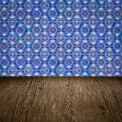 Image showing Wood table top and blur vintage ceramic tile pattern wall