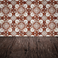 Image showing Wood table top and blur vintage ceramic tile pattern wall