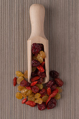 Image showing Wooden scoop with mixed dried fruits