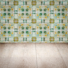 Image showing Wood table top and blur vintage ceramic tile pattern wall