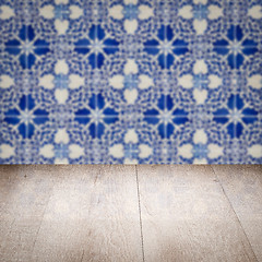 Image showing Wood table top and blur vintage ceramic tile pattern wall