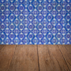 Image showing Wood table top and blur vintage ceramic tile pattern wall