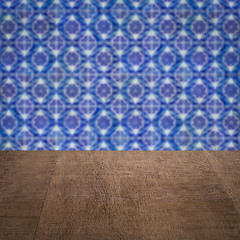 Image showing Wood table top and blur vintage ceramic tile pattern wall