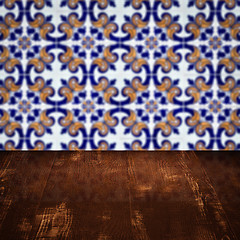 Image showing Wood table top and blur vintage ceramic tile pattern wall