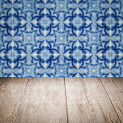 Image showing Wood table top and blur vintage ceramic tile pattern wall