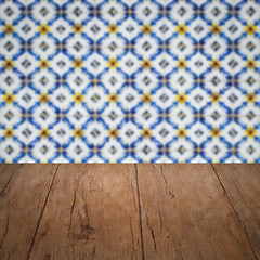 Image showing Wood table top and blur vintage ceramic tile pattern wall