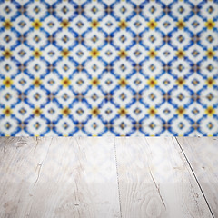 Image showing Wood table top and blur vintage ceramic tile pattern wall