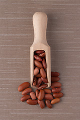 Image showing Wooden scoop with red beans
