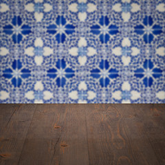 Image showing Wood table top and blur vintage ceramic tile pattern wall