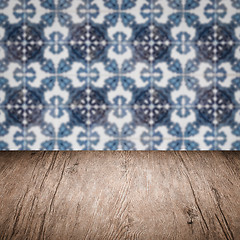 Image showing Wood table top and blur vintage ceramic tile pattern wall