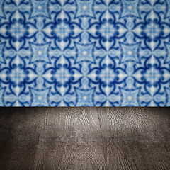 Image showing Wood table top and blur vintage ceramic tile pattern wall