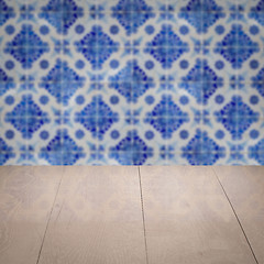 Image showing Wood table top and blur vintage ceramic tile pattern wall