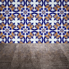 Image showing Wood table top and blur vintage ceramic tile pattern wall