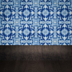 Image showing Wood table top and blur vintage ceramic tile pattern wall