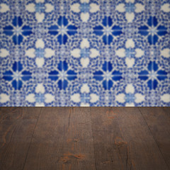 Image showing Wood table top and blur vintage ceramic tile pattern wall