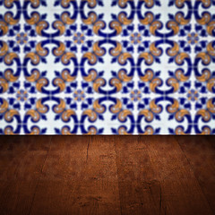 Image showing Wood table top and blur vintage ceramic tile pattern wall