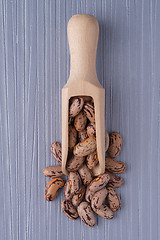 Image showing Wooden scoop with pinto beans