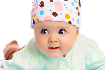 Image showing Beautiful baby in the cap. Close-up. Studio photo