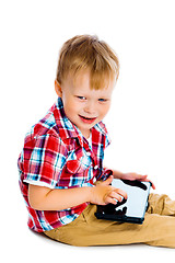 Image showing boy with a Tablet PC sitting on the floor