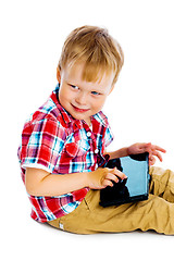 Image showing boy with a Tablet PC sitting on the floor