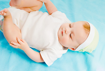 Image showing baby lying on a blue plaid