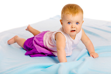 Image showing Crawling across the blue plaid baby girl