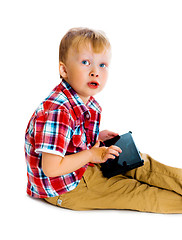 Image showing boy with a Tablet PC sitting on the floor