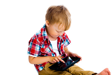 Image showing boy with a Tablet PC sitting on the floor