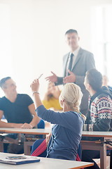 Image showing group of students with teacher on class