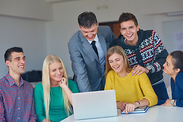 Image showing group of students getting suppport from teacher