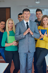 Image showing group portrait of teacher with students