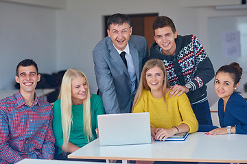 Image showing group of students getting suppport from teacher