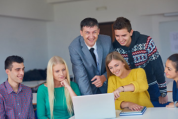 Image showing group of students getting suppport from teacher