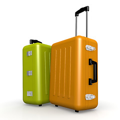 Image showing Orange and green luggages stand on the floor