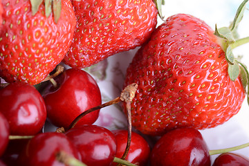 Image showing Background from fresh ripe strawberries and cherry