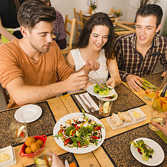 Image showing Friends lunching at the restaurant