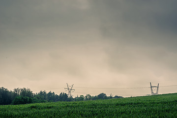 Image showing Pylons on a green field