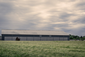 Image showing Agriculture barn on a green field