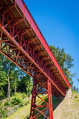 Image showing Red metal bridge in the summer